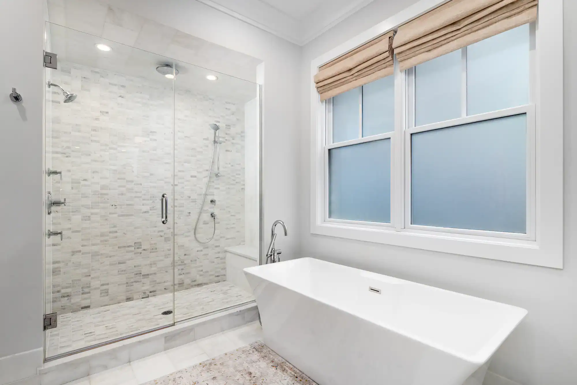Elegant bathroom with walk-in shower and freestanding bathtub.