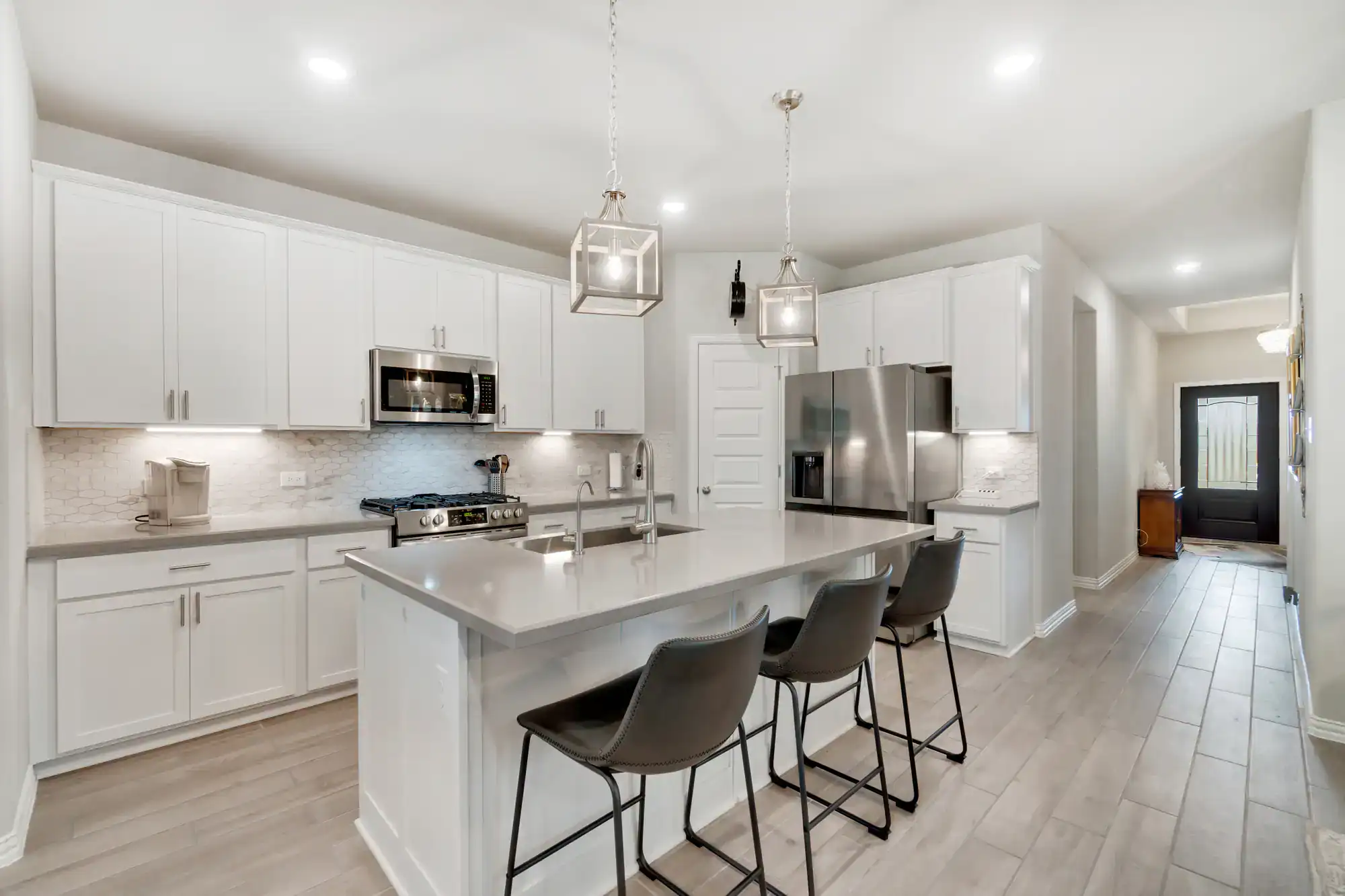 Contemporary kitchen with white cabinets and island in Ashton-Sandy Spring, MD.