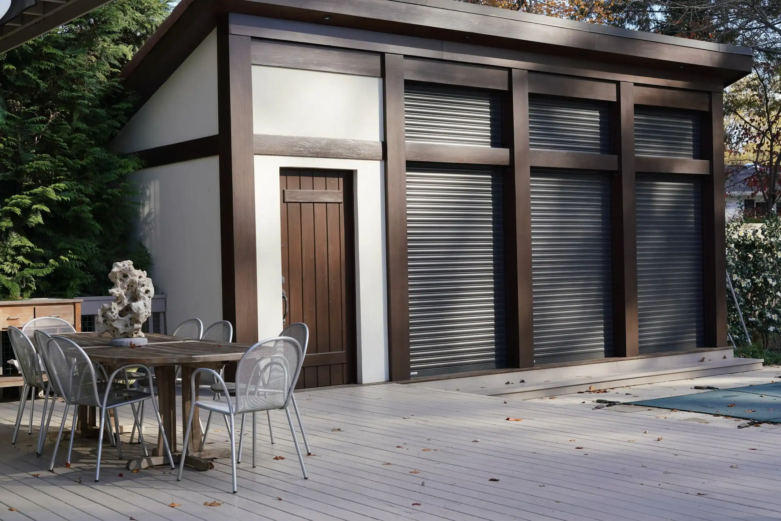 Contemporary outdoor shed with wooden and metal elements for storage.